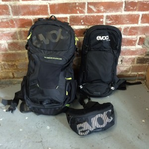 Three packs from EVOC (www.evocusa.com). On the left, the big dog with a capacity of 30 liters. On the right, the 10 liter (and my go-to for most rides). And in front, the ultra-hip, Hip-Pack...